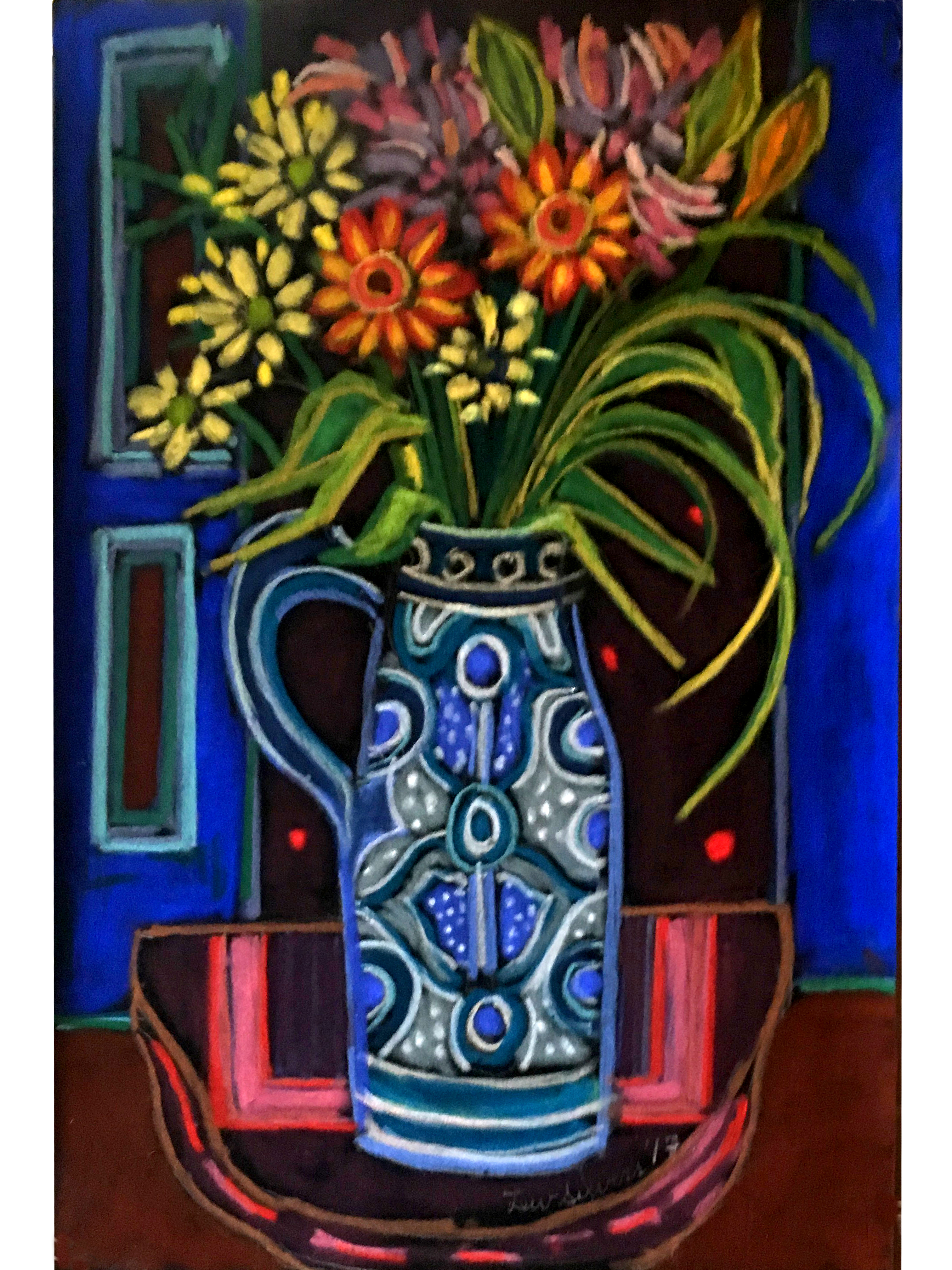 Multi-colored flowers in ornamental vase